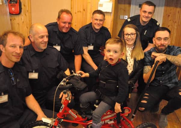 All smiles with Harry on his new trike PHOTO: Jonny McGrady