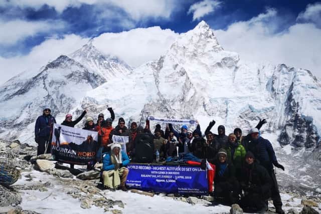 Melton's Ian Kerr and DJ Damion Houchen, with audience, celebrate breaking the world record for performing the highest altitude DJ Set on land (approx 5,590m) on the mountain of Kala Pattar in the Everest region of the Himalayas EMN-191204-111427001