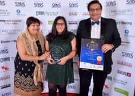 Winners, from left, Heena Dawda with Soi Indian Restaurant owner,  Atul Dawda and his daughter Lara Dawda.