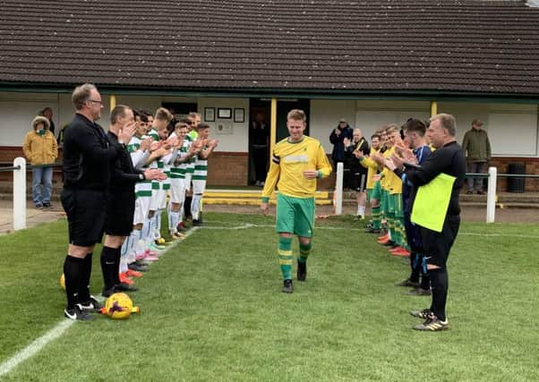 Guard of honour for Michael Stevenson at the beginning of the game. EMN-190429-135316002