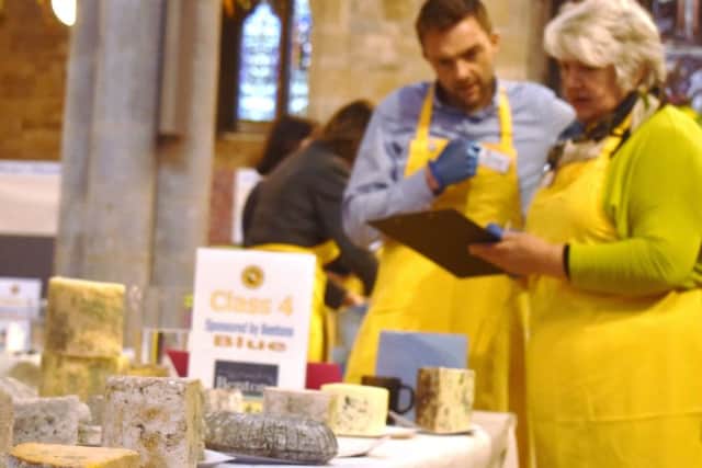 Two of the judges in action at the 2019 Artisan Cheese Awards at Melton's St Mary's Church EMN-190425-161358001