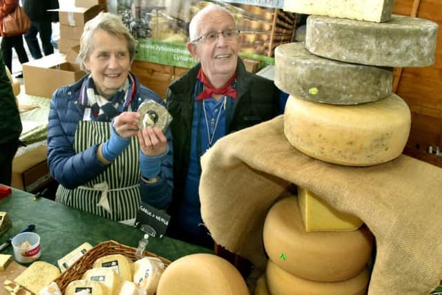 Judy Smales shows off her Lyburn Cheeses to customer Eric Bryant PHOTO: Tim Williams