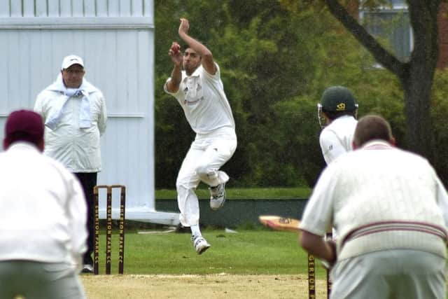 Egerton Park's new overseas player Khush Taliti bowling in the rain EMN-190705-162017002