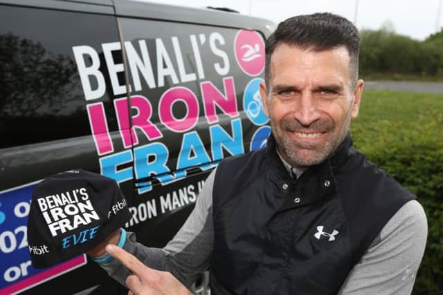 Former Premier League footballer Francis Benali shows off the cap he wore, bearing the name of a Melton schoolgirl who recently finished cancer treatment, which inspired him in his fundraising efforts to complete seven ironman triathlons EMN-191005-153111001