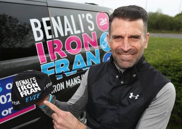 Former Premier League footballer Francis Benali shows off the cap he wore, bearing the name of a Melton schoolgirl who recently finished cancer treatment, which inspired him in his fundraising efforts to complete seven ironman triathlons EMN-191005-153111001