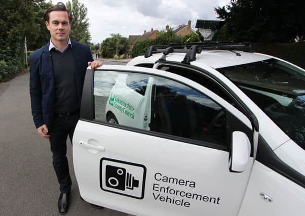 Councillor Blake Pain with the camera enforcement vehicle being used by Leicestershire County Council to clamp down on motorists who park irresponsibly outside schools EMN-190513-140742001