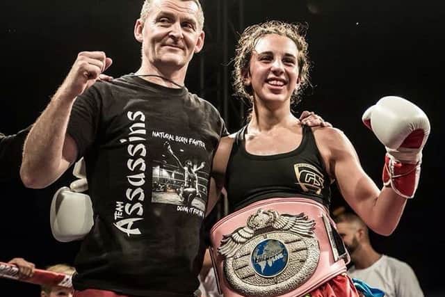 Iman Barlow, pictured with her dad Mark, is Enfusion's longest-running kickboxing world champ EMN-190515-143316002