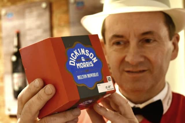 Managing director, Stephen Hallam, shows off the new packaging for the revamped Dickinson and Morris Melton Mowbray pork pie outside Ye Olde Pork Pie Shoppe in Nottingham Street, Melton EMN-190520-161355001