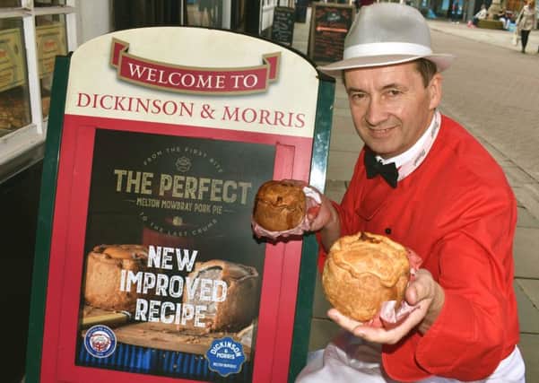 Managing director, Stephen Hallam, shows off the revamped Dickinson and Morris Melton Mowbray pork pie outside Ye Olde Pork Pie Shoppe in Nottingham Street, Melton EMN-190520-161428001
