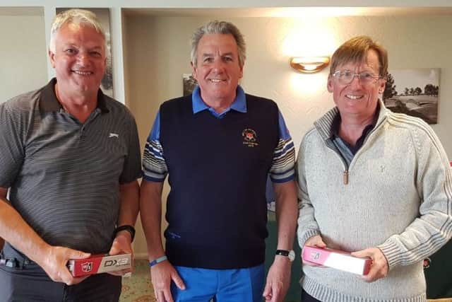 Fourth-placed Melton pairing Adrian Grant (left) and vice-captain John Harvey (right) receive their prizes from club captain Gerry Stephens EMN-190521-092017002