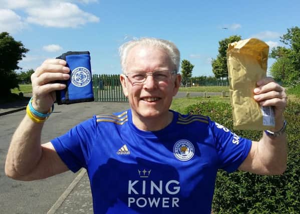 Melton pensioner Graham Shaw celebrates having his wallet anonymously sent back to him after he lost it in the town with £105 cash and a Leicester City FC season ticket inside EMN-190521-120700001