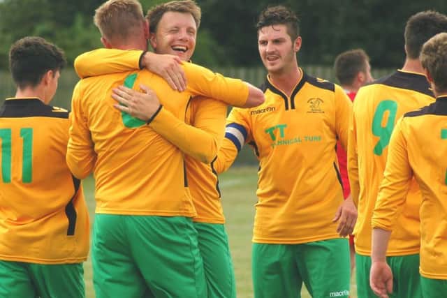 Michael Stevenson is congratulated by his long-time team-mate and friend Ian Bitmead EMN-190522-144825002