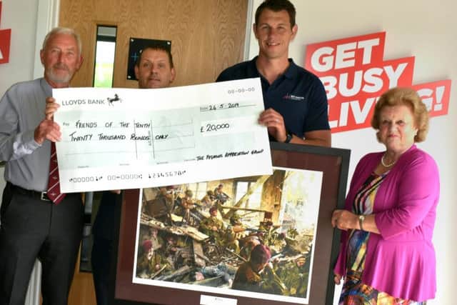 From the left, Alec Wilson (chairman of Friends of 10th) , Rich Greasley (Pegasus Appreciation Group), Louis Deacon (Get Busy Living) and Lady Gretton (President Friends of 10th) pictured as a lmited edition print is presented to the Matt Hampson Foundation EMN-190529-133642001