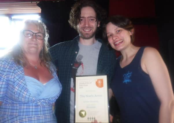 David Lawrence and Jessica Cresswell, landlords of the Noels Arms pub in Melton, are presented with a certificate, for their pub being named Melton CAMRA Cider Pub of the Year, by Karen Hine (left), a Melton branch of the Campaign for Real Ale Cider representative EMN-190531-105326001