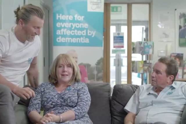 Steve and Carol Freer with Robbie Savage in a scene from a video for a campaign about dementia EMN-190531-174307001