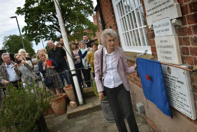 Christine Fowler unveils the Hickling memorial to her uncles, Charlie and Cecil Simpson, who were killed on the Somme during the First World War EMN-190306-095624001