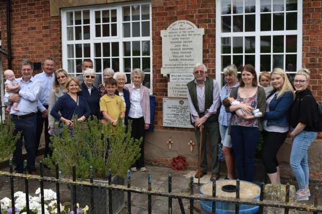 Relatives of the Simpson brothers, who were killed in the First World War, gather for the unveiling of a memorial to them at Hickling EMN-190306-095612001