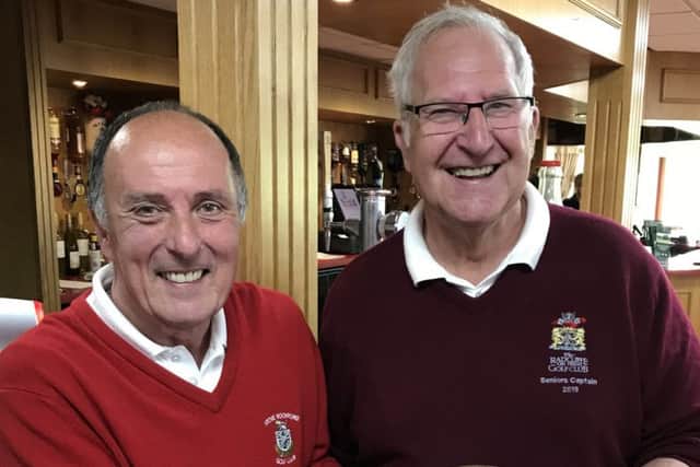 Radcliffe Seniors captain Steve Lawes (right) presents the Friendship Trophy to Stoke Rochford vice-captain Mike Thornton EMN-190406-104646002