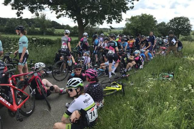 Riders wait for the re-start following the 40-rider crash. Picture: Colin Clews EMN-191106-132235002