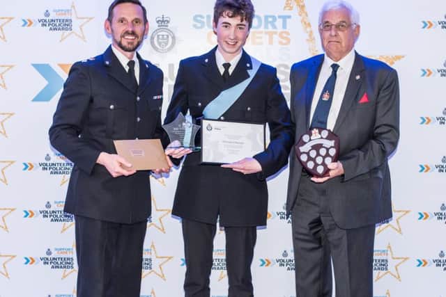 Meltons High Sheriff Cadet Finley ORiordan receives the Community Service Shield at the Leicestershire Police Volunteers in Policing Awards night flanked by Chief Superintendent Adam Streets and David Ball (from the Royal Society of Saint George) EMN-191106-151143001