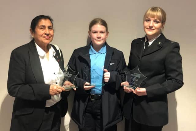 Kimberly Pulley (right), a member of the Melton response team, with her award for being named Special Constable of the Year, with fellow winners, from left, Harbans Thiaray and Quinn Burgess, at the Leicestershire Police Volunteers in Policing Awards night EMN-191106-151155001