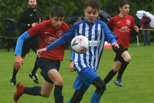 Under 13s winners Football First take on Ibstock EMN-191206-104550002