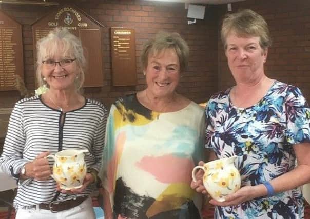 Ladies Invitation winners Sue Booth and Jan Johnson receive their prize from lady president Norma Varley EMN-190625-132108002