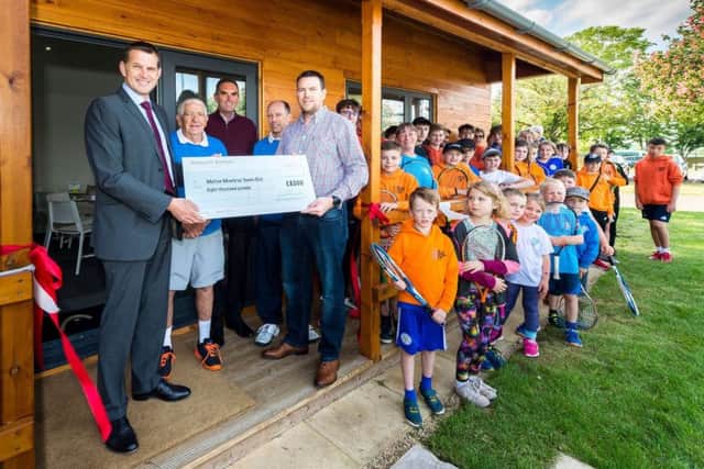 Samworth Brothers Sports Opportunity Fund trustees Stephen Draisey and Tim Barker present the award to the club EMN-190620-152249002