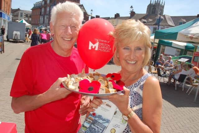 Derek Simmonds and Jenny Barnes promote the Melton Centenary Trail in aid of Birch Wood Area Special School at the town's Paint The Town Red event on Sunday EMN-190621-091622001
