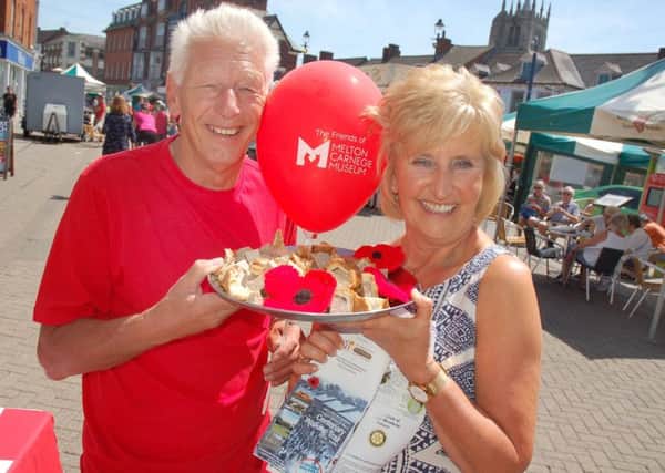 Derek Simmonds and Jenny Barnes promote the Melton Centenary Trail in aid of Birch Wood Area Special School at the town's Paint The Town Red event on Sunday EMN-190621-091622001