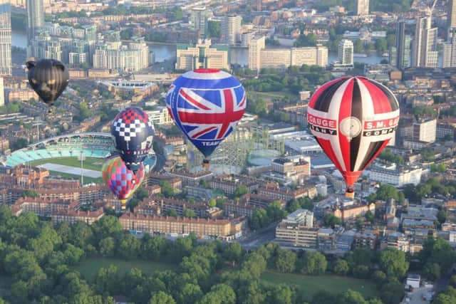The Belvoir Brewery balloon flies over the city of London in the Ricoh Lord Mayors Hot Air Balloon RegattaPHOTO MARCUS GREEN EMN-190621-163803001