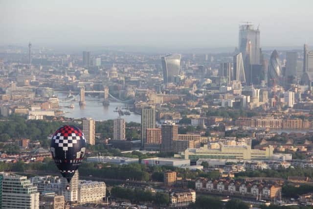 The Belvoir Brewery balloon flies over the city of London in the Ricoh Lord Mayors Hot Air Balloon RegattaPHOTO MARCUS GREEN EMN-190621-163823001