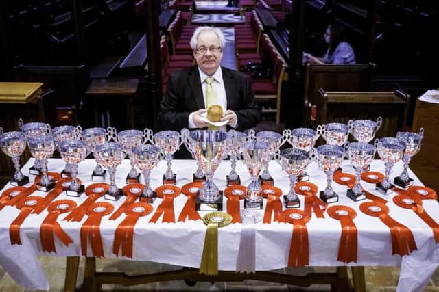 British Pie Awards chairman, Matthew O'Callaghan, with the trophies lined up in St Mary's Church, Melton, at this year's event EMN-190624-121245001