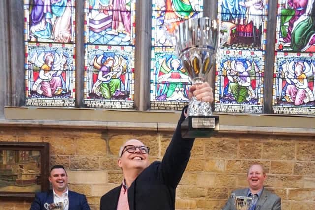 Jon Thorner (centre) celebrates winning the Supreme Champion prize at the 2019 British Pie Awards EMN-190624-121258001