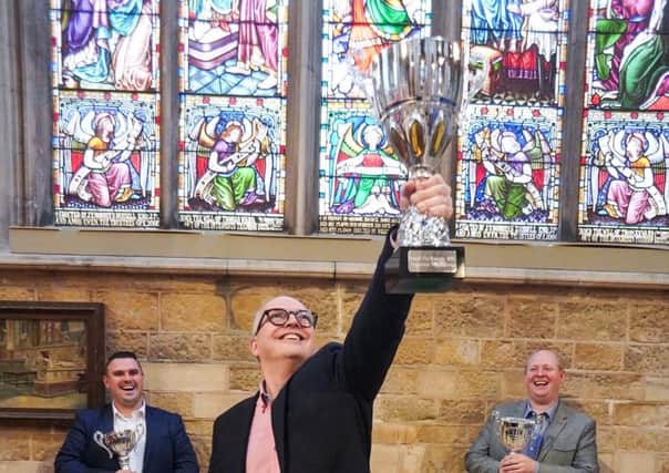 Jon Thorner (centre) celebrates winning the Supreme Champion prize at the 2019 British Pie Awards EMN-190624-121258001