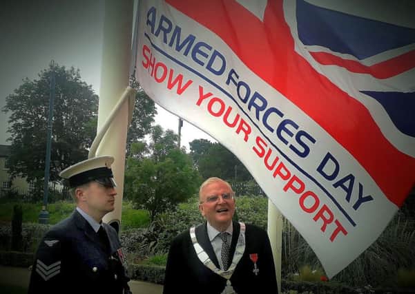 The flag-raising ceremony for Armed Forces Day outside the Melton Borough Council offices - Mayor of Melton, Councillor Malise Graham, with Sgt Melvin Whyte, who hoisted the flag EMN-190624-155426001
