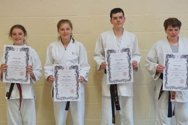 New black belts - Charlotte Raisen, Hannah Skelton, Charlie Loxley and Cameron Whiteman EMN-190626-173935002