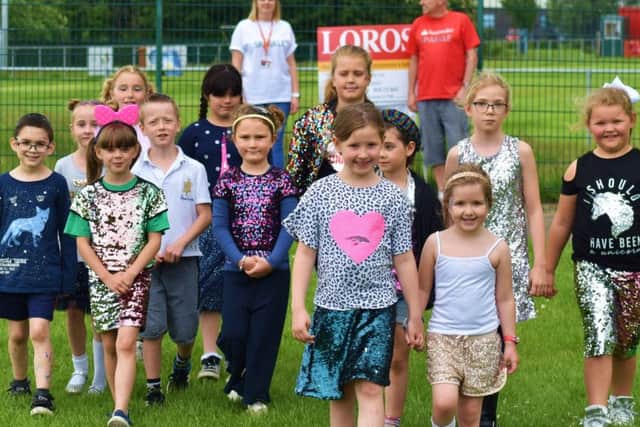 Pupils and staff at Sherard Primary School take part in their fundraising 'Sparkle Walk' in memory of former teacher, Lynda Spargo, who recently passed away EMN-190626-131021001