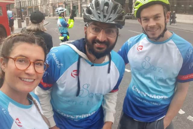 Holly Jones and her boyfriend, Conor Turner, with former England cricket star, Monty Panesar, who also took part in the fundraising cycle to Paris EMN-190628-102814001
