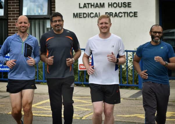 Dr Matt Riley (second from right) with fellow Latham House Medical Practice doctors Paul Atkinson, Gangadhar Dabli and Smile Paliath, who will be helping run the Melton Parkrun for one day only EMN-190207-162441001