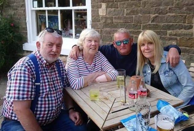 Janet Jones (second from left), who was missing for nearly 12 hours, pictured back with family members on Sunday, from left, husband Ellis, son-in-law Ian Young and daughter Clare Young EMN-190107-142927001