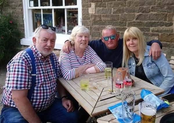 Janet Jones (second from left), who was missing for nearly 12 hours, pictured back with family members on Sunday, from left, husband Ellis, son-in-law Ian Young and daughter Clare Young EMN-190107-142927001