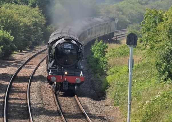 The Flying Scotsman heads away from Langham
PHOTO PAUL DAVIES EMN-190207-134654001