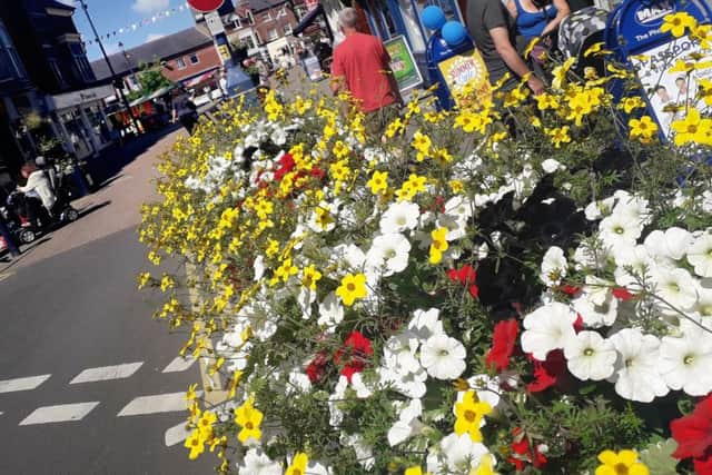 The attractive floral baskets in Sherrard Street in Melton EMN-190407-131411001