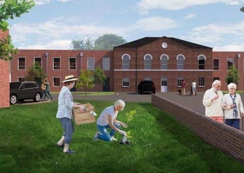 An artist's impression of the what the planned redevelopment of Melton's old St Mary's Hospital site might look like at the entrance to the site on Thorpe Road EMN-190907-121823001