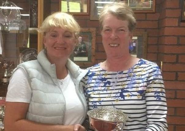 Lady captain Karen Rawson (left) presents Sue Booth with the Keymin Trophy. EMN-190907-121307002