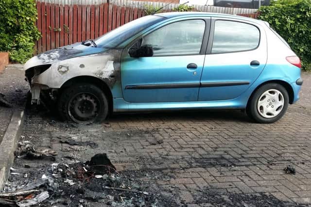A Peugeot 206 damaged in Drummond Walk during an arson attack on the Fairmead Estate in Melton EMN-190907-175107001