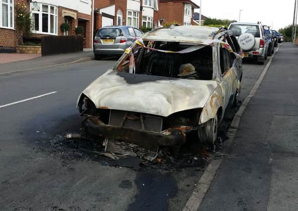 A Ford Mondeo destroyed by an arson attack in The Crescent in August 2016 - one of two cars sets alight deliberately in separate incidents five minutes apart in Melton EMN-191007-104349001