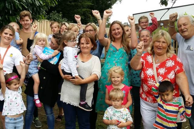 Staff and parents at Oasis Pre-School celebrate it being saved from closure EMN-191007-102711001
