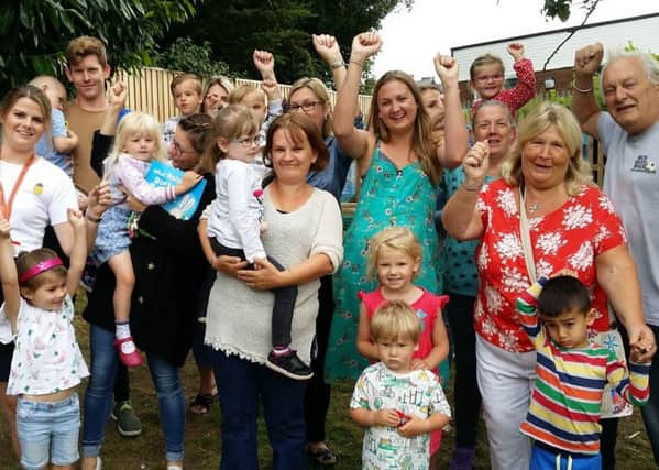 Staff and parents at Oasis Pre-School celebrate it being saved from closure EMN-191007-102711001